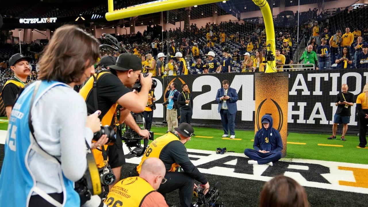 Michigan quarterback J.J. McCarthy meditates before the College Football Playoff national championship game against Washington at NRG Stadium in Houston, Texas on Monday, January 8, 2024.