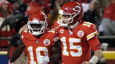 Kansas City Chiefs wide receiver Tyreek Hill (10) celebrates his touchdown with quarterback Patrick Mahomes (15) against the Buffalo Bills during the second half of the AFC Divisional playoff football game at GEHA Field at Arrowhead Stadium.