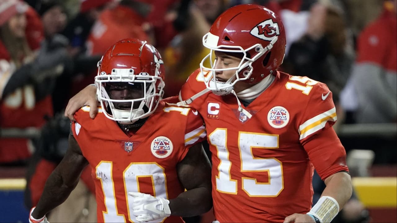 Kansas City Chiefs wide receiver Tyreek Hill (10) celebrates his touchdown with quarterback Patrick Mahomes (15) against the Buffalo Bills during the second half of the AFC Divisional playoff football game at GEHA Field at Arrowhead Stadium.