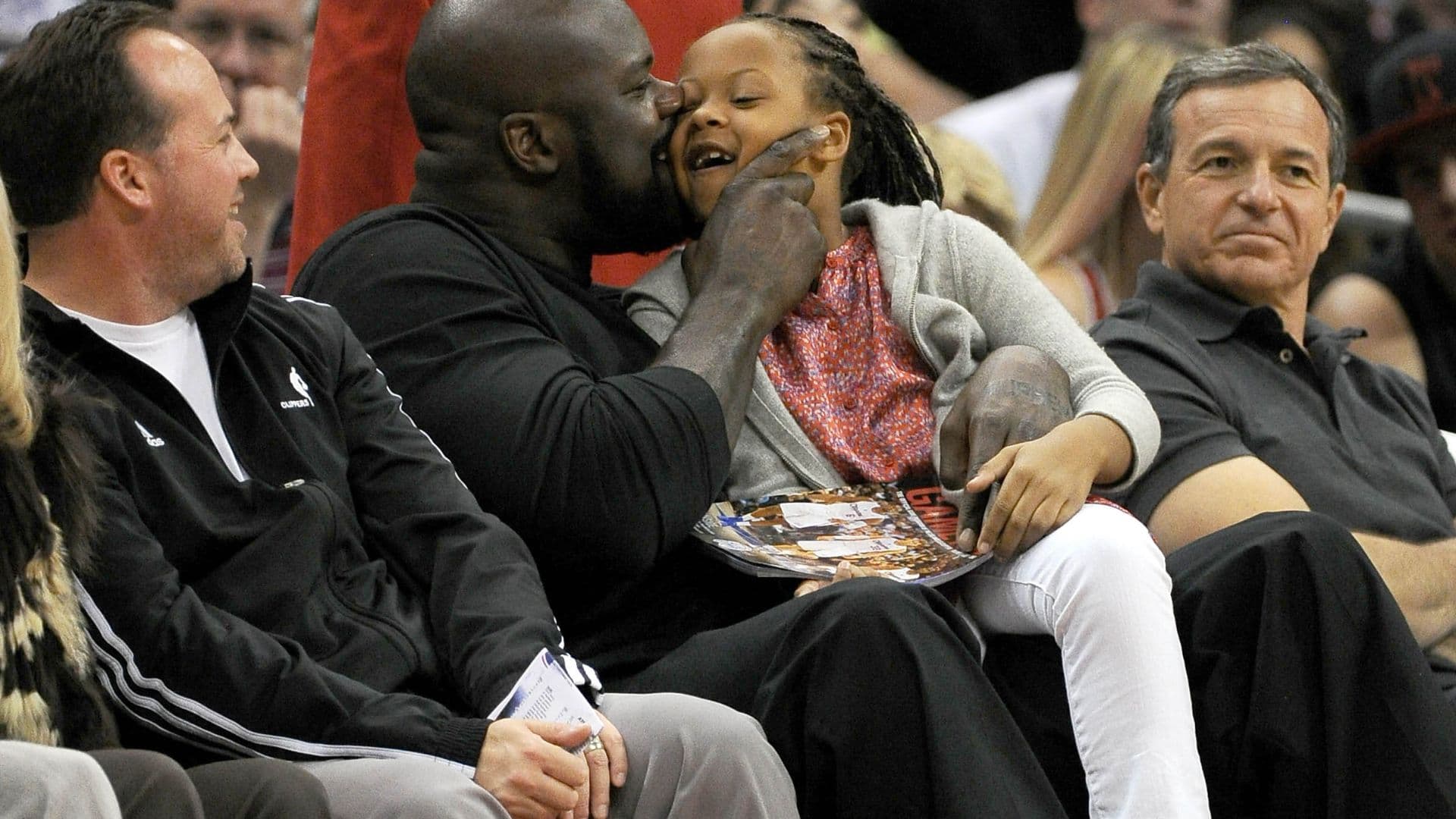 November 11, 2012; Los Angeles, CA, USA; NBA former player Shaquille O'Neal watches the game between the Los Angeles Clippers and the Atlanta Hawks with his daughter Me'arah, 6, at the Staples Center.