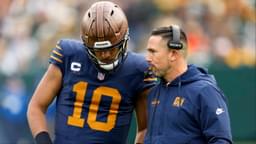 Green Bay Packers head coach Matt LaFleur talks to quarterback Jordan Love (10) during the second half against the Carolina Panthers at Lambeau Field.