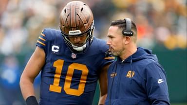 Green Bay Packers head coach Matt LaFleur talks to quarterback Jordan Love (10) during the second half against the Carolina Panthers at Lambeau Field.
