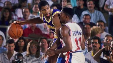 Detroit, MI, USA; FILE PHOTO; Los Angeles Lakers guard Magic Johnson (32) is defended by Detroit Pistons guard Isiah Thomas (11) at the Silverdome.