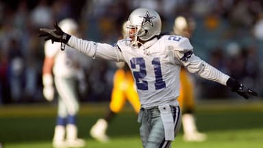 Dallas Cowboys defensive back Deion Sanders (21) reacts on the field against the Pittsburgh Steelers during Super Bowl XXX at Sun Devil Stadium. Dallas defeated Pittsburgh 27-17.