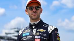 Jun 21, 2025; Long Pond, Pennsylvania, USA; NASCAR Cup Series driver Daniel Suarez walks on pit road during practice and qualifying for The Great American Getaway 400 at Pocono Raceway