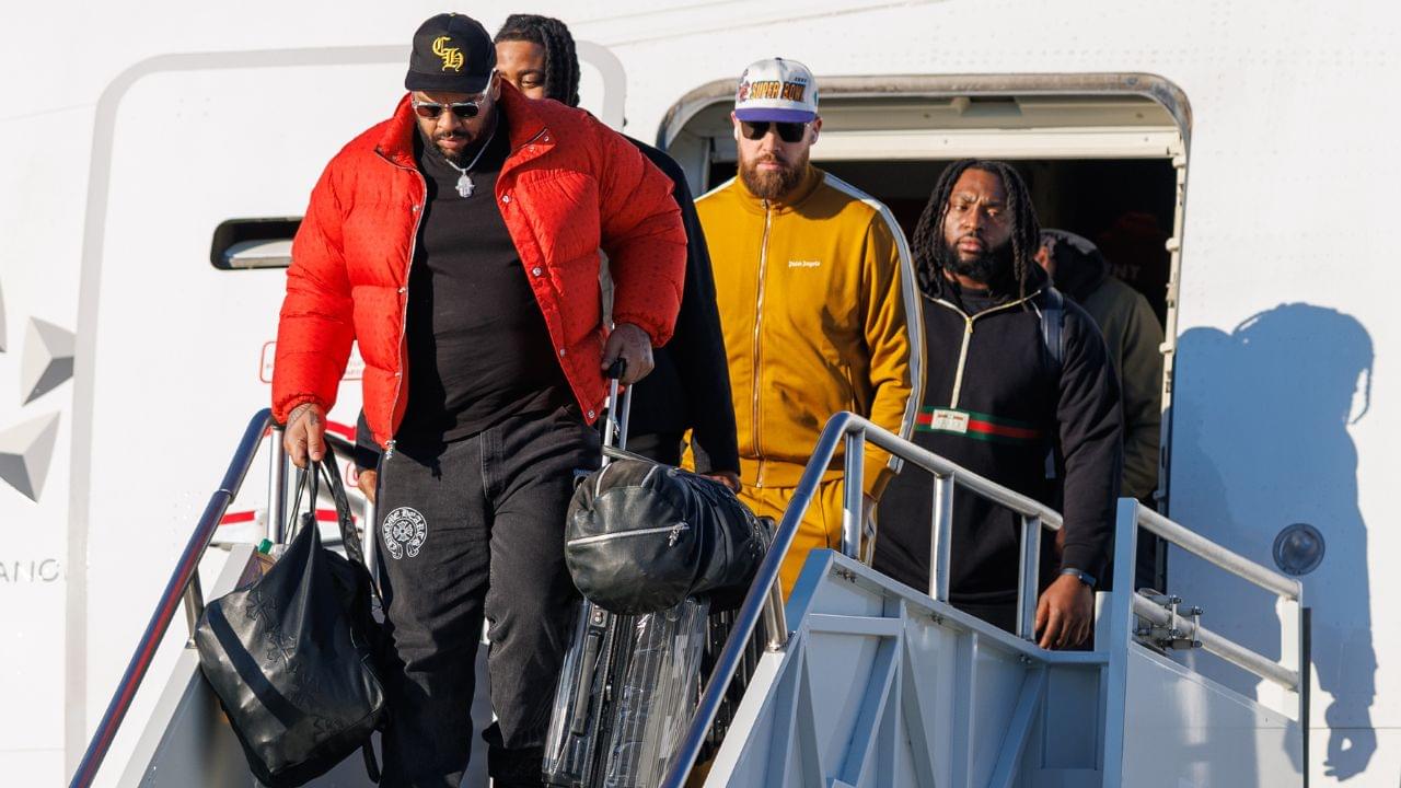 Kansas City Chiefs tight end Travis Kelce (87) exits the plane after arriving at Louis Armstrong New Orleans International Airport.