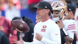 San Francisco 49ers head coach Kyle Shanahan tosses a football in the air during warm ups prior to a game against the New York Giants at MetLife Stadium.