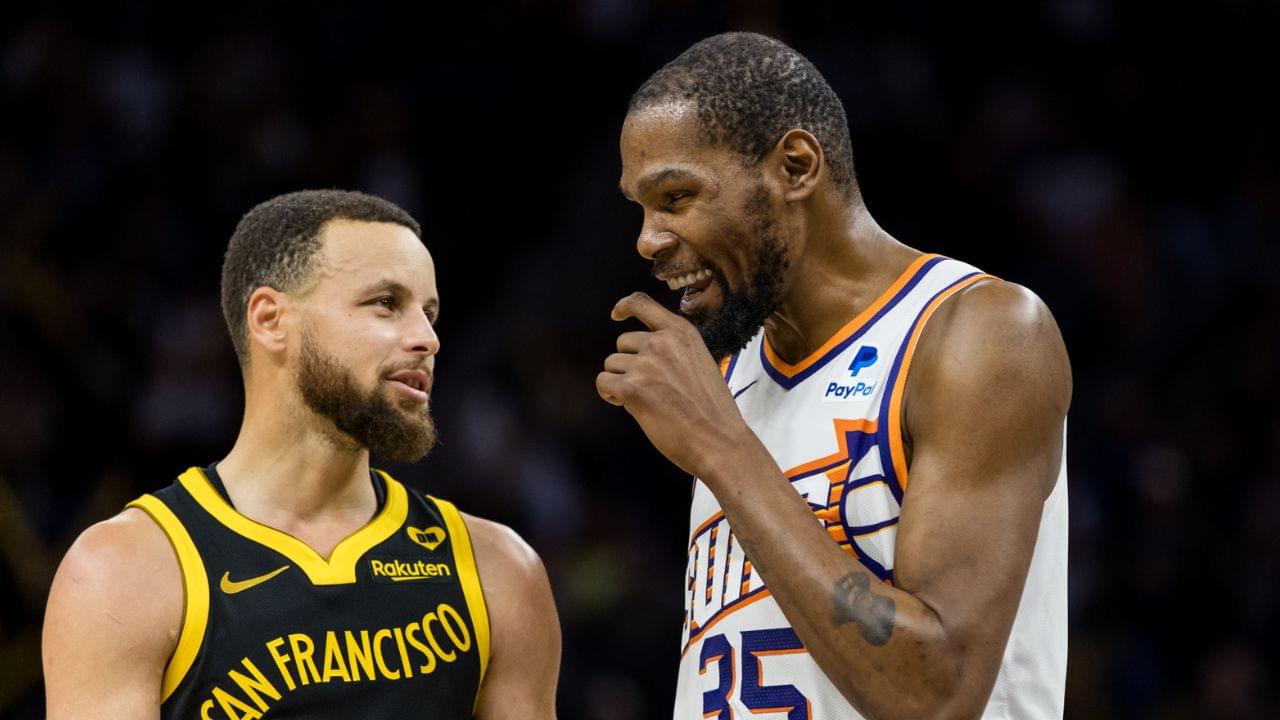 Golden State Warriors guard Stephen Curry (30) and Phoenix Suns forward Kevin Durant (35) talk during the second half at Chase Center.