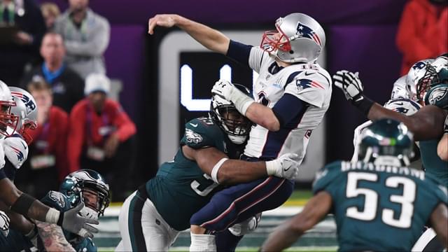 Philadelphia Eagles defensive end Brandon Graham (55) sacks New England Patriots quarterback Tom Brady (12) to fumble the ball in the fourth quarter in Super Bowl LII at U.S. Bank Stadium.