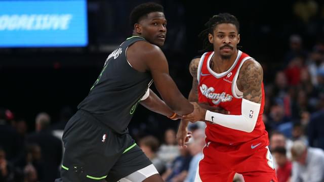 Apr 10, 2025; Memphis, Tennessee, USA; Minnesota Timberwolves guard Anthony Edwards (5) and Memphis Grizzlies guard Ja Morant (12) battle for position during the third quarter at FedExForum