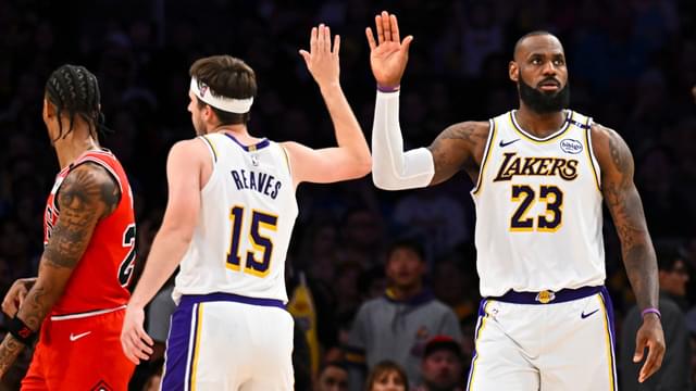 Mar 22, 2025; Los Angeles, California, USA; Los Angeles Lakers forward LeBron James (23) fives guard Austin Reaves (15) after scoring against the Chicago Bulls during the second half at Crypto.com Arena.