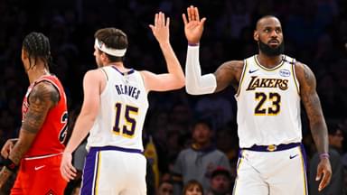 Mar 22, 2025; Los Angeles, California, USA; Los Angeles Lakers forward LeBron James (23) fives guard Austin Reaves (15) after scoring against the Chicago Bulls during the second half at Crypto.com Arena.