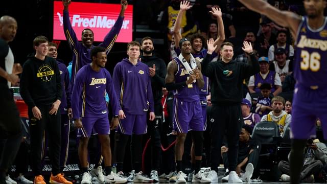 Nov 3, 2025; Portland, Oregon, USA; The Los Angeles Lakers celebrate during the second half in the closing minutes during a game between the Portland Trail Blazers and the Los Angeles Lakers at Moda Center.