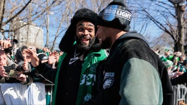 Philadelphia Eagles defensive end Brandon Graham (55) speaks to running back Saquon Barkley (26) during the Super Bowl LIX championship parade and rally.