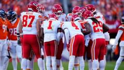 Members of the Kansas City Chiefs offensive squad huddle in the second quarter against the Denver Broncos at Empower Field at Mile High.
