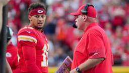 Kansas City Chiefs quarterback Patrick Mahomes (15) talks with head coach Andy Reid after a play against the Chicago Bears during the first half of the game at GEHA Field at Arrowhead Stadium.