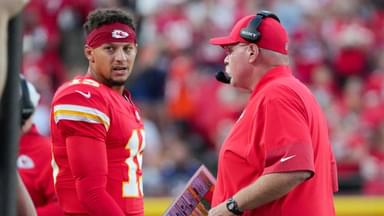 Kansas City Chiefs quarterback Patrick Mahomes (15) talks with head coach Andy Reid after a play against the Chicago Bears during the first half of the game at GEHA Field at Arrowhead Stadium.