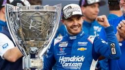 Nov 2, 2025; Avondale, Arizona, USA; NASCAR Cup Series driver Kyle Larson (5) celebrates with the Bill France Cup trophy after clinching the 2025 NASCAR Cup Series Championship following the NASCAR Championship race at Phoenix Raceway.