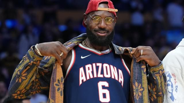 Oct 24, 2025; Los Angeles, California, USA; Los Angeles Lakers forward LeBron James poses in the Arizona Wildcats jersey of his son Bryce James (6) during the game against the Minnesota Timberwolves at Crypto.com Arena.