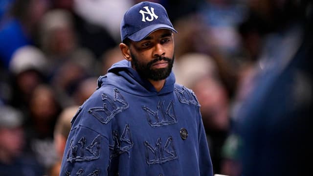 Dallas Mavericks guard Kyrie Irving (11) looks on during the second half against the Memphis Grizzlies at the American Airlines Center.