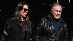 Former New England Patriots head coach Bill Belichick and girlfriend Jordon Hudson enter the field before the game between the Notre Dame Fighting Irish and the Navy Midshipmen at MetLife Stadium.