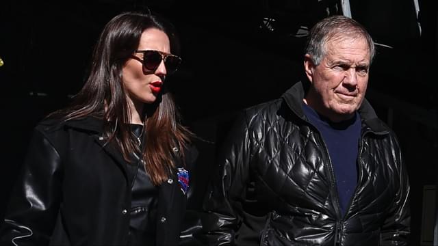 Former New England Patriots head coach Bill Belichick and girlfriend Jordon Hudson enter the field before the game between the Notre Dame Fighting Irish and the Navy Midshipmen at MetLife Stadium.