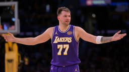 Nov 28, 2025; Los Angeles, California, USA; Los Angeles Lakers guard Luka Doncic (77) reacts after a foul on Dallas Mavericks forward Naji Marshall (13) in the second half at Crypto.com Arena