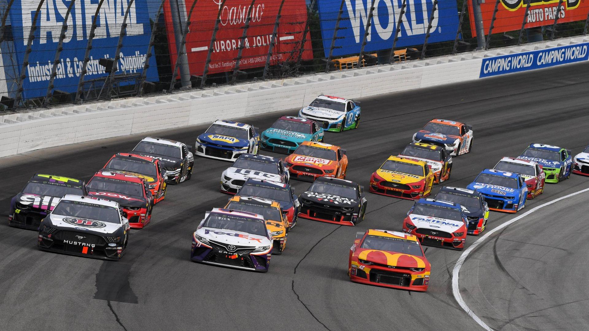 Jun 30, 2019; Joliet, IL, USA; NASCAR Cup Series driver Kevin Harvick (4) leads the field during the Camping World 400 at Chicagoland Speedway