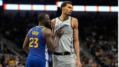San Antonio Spurs forward Victor Wembanyama (1) waits for an inbound pass while defended by Golden State Warriors forward Draymond Green (23) during the second half at Frost Bank Center.