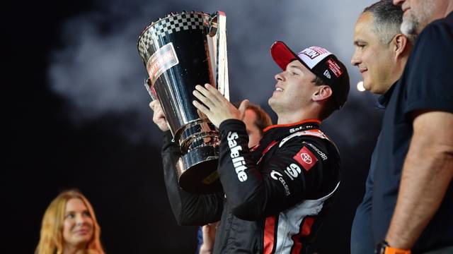 Oct 31, 2025; Avondale, Arizona, USA; NASCAR Gander RV and Outdoors Truck Series driver Corey Heim (11) celebrates his victory following the Truck Series Championship race at Phoenix Raceway
