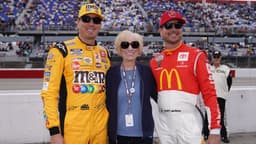 May 8, 2022; Darlington, South Carolina, USA; NASCAR Cup Series driver Kyle Busch (L) poses for a picture with his mother Gaye Busch (C) and brother Kurt Busch (R) on pit road prior to the Goodyear 400 at Darlington Raceway