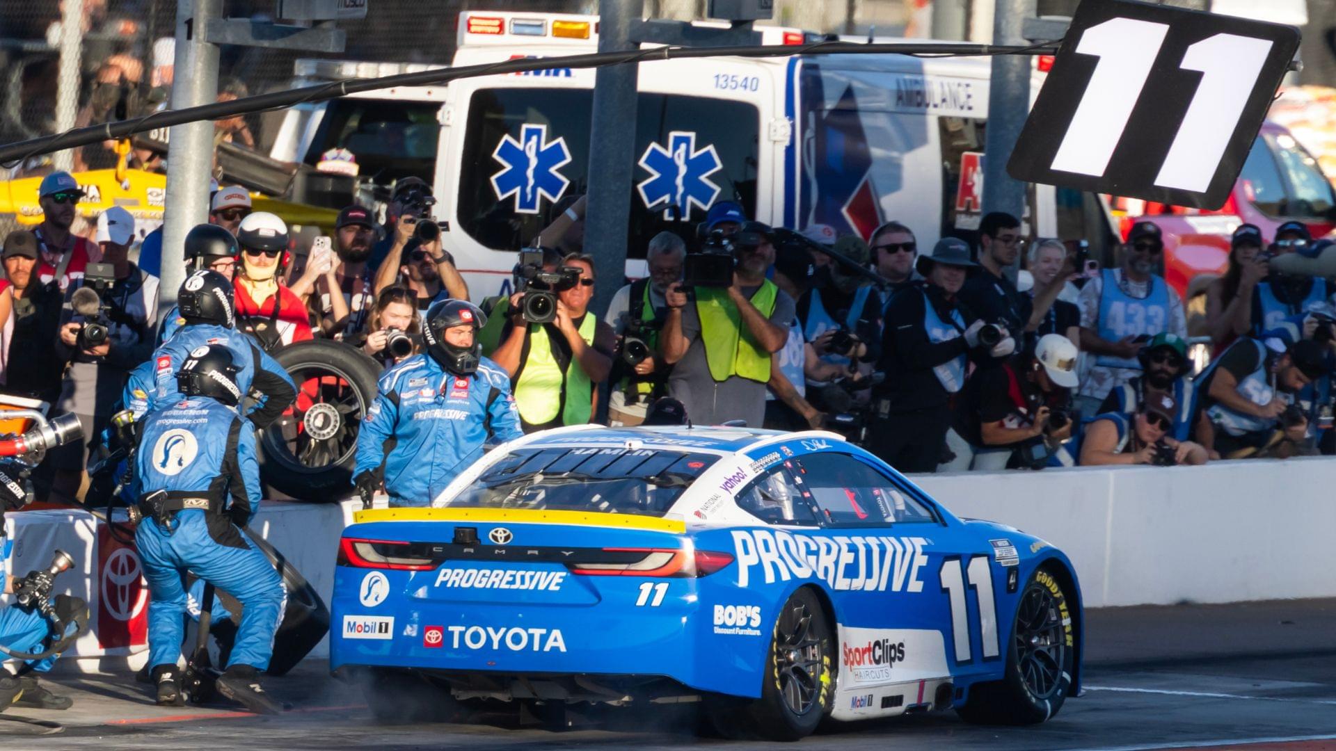 Nov 2, 2025; Avondale, Arizona, USA; NASCAR Cup Series driver Denny Hamlin (11) makes a pit stop during the NASCAR Championship race at Phoenix Raceway.