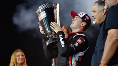 Oct 31, 2025; Avondale, Arizona, USA; NASCAR Gander RV and Outdoors Truck Series driver Corey Heim (11) celebrates his victory following the Truck Series Championship race at Phoenix Raceway.