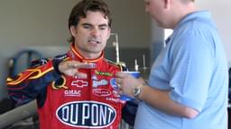 Jeff Gordon, left, driver of the No. 24 DuPont Chevrolet, talks to his crew chief Steve Letarte in the garage during NASCAR, Motorsport, USA preseason testing at the Daytona International Speedway in Daytona Beach, Florida