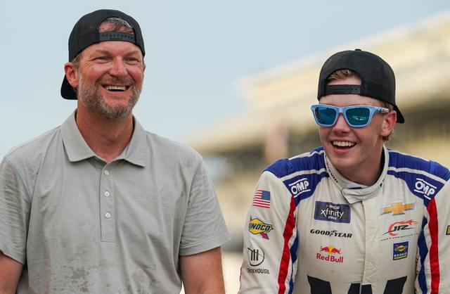 Dale Earnhardt Jr. smiles for a photo with NASCAR Xfinity Series driver Connor Zilisch (88) on Saturday, July 26, 2025, after winning the Pennzoil 250 at Indianapolis Motor Speedway.