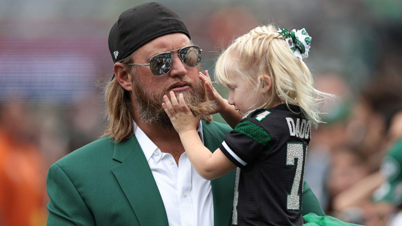 Retired New York Jets center Nick Mangold with his daughter before the game against the Cincinnati Bengals at MetLife Stadium.