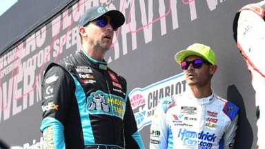 ATLANTA, GA - SEPTEMBER 08: Denny Hamlin ( 11 Joe Gibbs Racing Mavis Tire Toyota) and Kyle Larson ( 5 Hendrick Motorsports HendrickCars.com Chevrolet) talk prior to the running of the NASCAR, Motorsport, USA Cup Series Quaker State 400