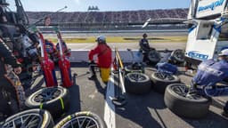 Oct 19, 2025; Talladega, Alabama, USA; Pit crews wait for their drivers during stage two of the YellaWood 500 at Talladega Superspeedway