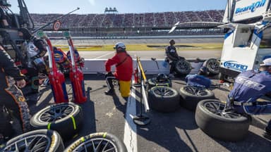 Oct 19, 2025; Talladega, Alabama, USA; Pit crews wait for their drivers during stage two of the YellaWood 500 at Talladega Superspeedway