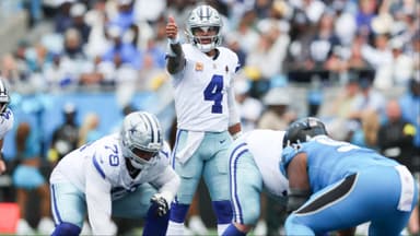 Dallas Cowboys quarterback Dak Prescott (4) communicates before the start of a play against the Carolina Panthers in the second quarter at Bank of America Stadium before the playoffs.