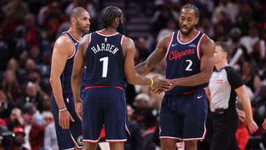 Dec 11, 2025; Houston, Texas, USA; Los Angeles Clippers forward Kawhi Leonard (2) reacts with guard James Harden (1) and forward Nicolas Batum (33) after a play during the fourth quarter against the Houston Rockets at Toyota Center.