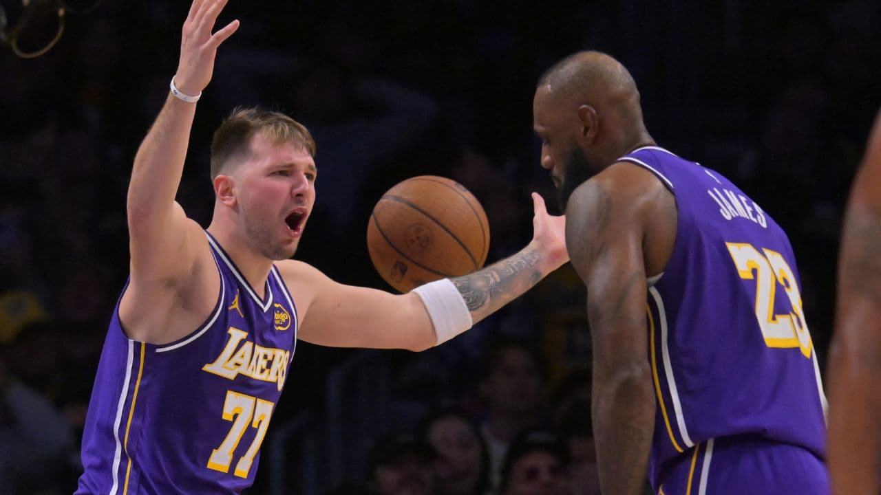 Los Angeles Lakers guard Luka Doncic (77) and forward Lebron James (23) react after a foul call during the second half against the San Antonio Spurs at Crypto.com Arena.
