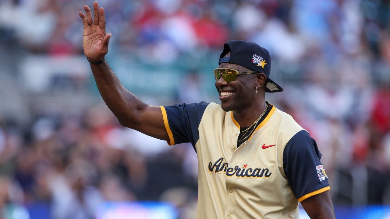 NFL Hall of Fame wide receiver Terrell Owens of the American League shows emotion during the 2025 All Star Celebrity Softball Game at Truist Park.