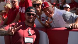 Former Texas A&M Aggies quarterback Johnny Manziel poses with Alabama Crimson Tide fans during a game against the Vanderbilt Commodores at Saban Field at Bryant-Denny Stadium.