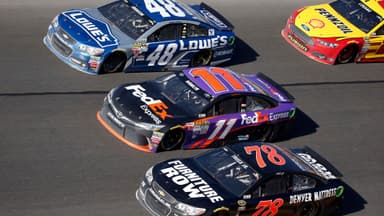 Feb 22, 2015; Daytona Beach, FL, USA; NASCAR Sprint Cup Series drivers Jimmie Johnson (48), Denny Hamlin (11) and Martin Truex Jr. during the Daytona 500 at Daytona International Speedway.