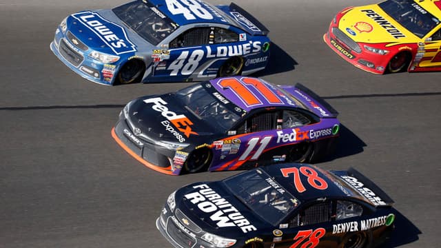 Feb 22, 2015; Daytona Beach, FL, USA; NASCAR Sprint Cup Series drivers Jimmie Johnson (48), Denny Hamlin (11) and Martin Truex Jr. during the Daytona 500 at Daytona International Speedway.