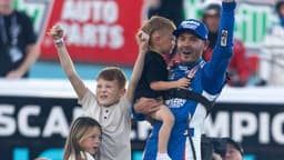 Nov 2, 2025; Avondale, Arizona, USA; NASCAR Cup Series driver Kyle Larson (5) celebrates with children Owen Larson, Audrey Larson and Cooper Larson after clinching the 2025 NASCAR Cup Series Championship following the NASCAR Championship race at Phoenix Raceway