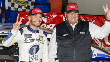 May 30, 2021; Concord, North Carolina, USA; NASCAR Cup Series driver Kyle Larson (5) celebrates his win with team owner Rick Hendrick at the Coca-Cola 600 at Charlotte Motor Speedway. Mandatory Credit: Jim Dedmon-Imagn Images