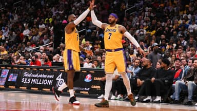 Mar 19, 2022; Washington, District of Columbia, USA; Los Angeles Lakers forward Carmelo Anthony (7) high fives forward LeBron James (6) during the second half against the Washington Wizards at Capital One Arena