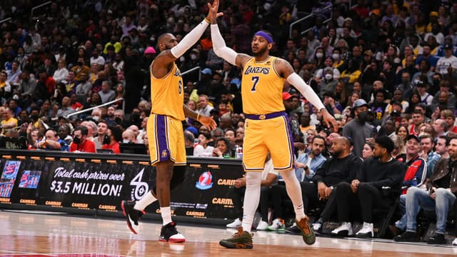 Mar 19, 2022; Washington, District of Columbia, USA; Los Angeles Lakers forward Carmelo Anthony (7) high fives forward LeBron James (6) during the second half against the Washington Wizards at Capital One Arena